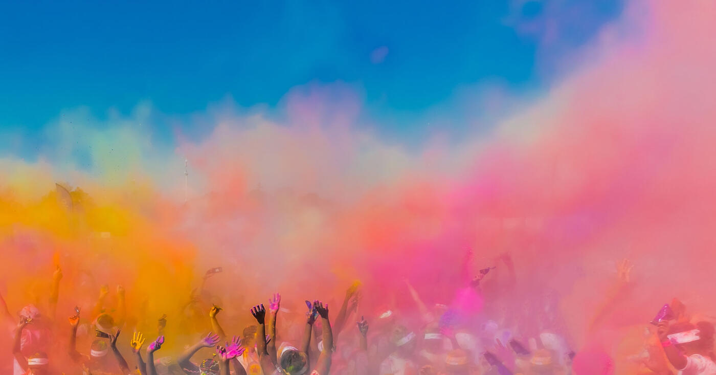 Colour clouds rising over a Colour My Run crowd